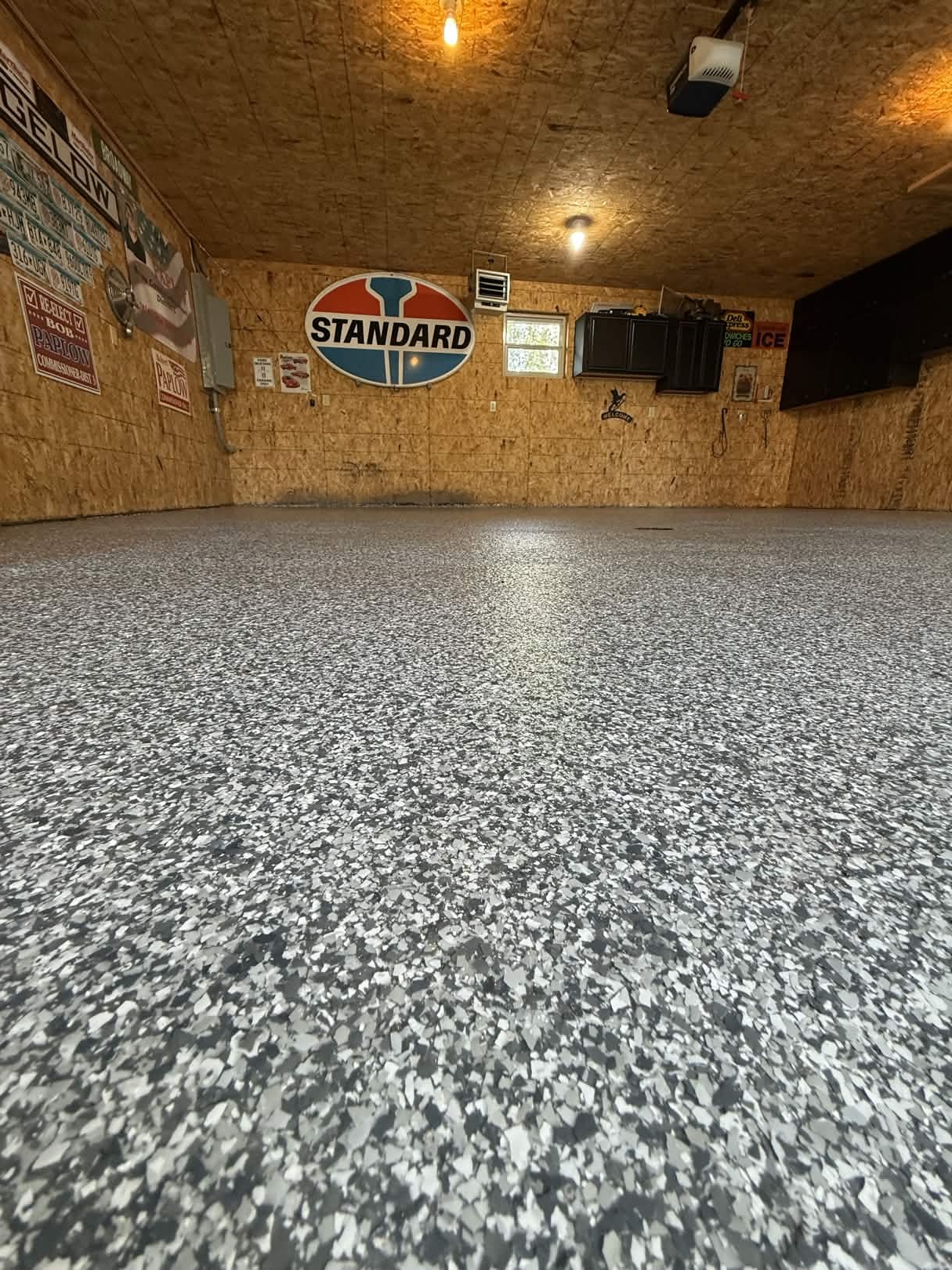 Standard garage β salt & pepper epoxy, lit at night