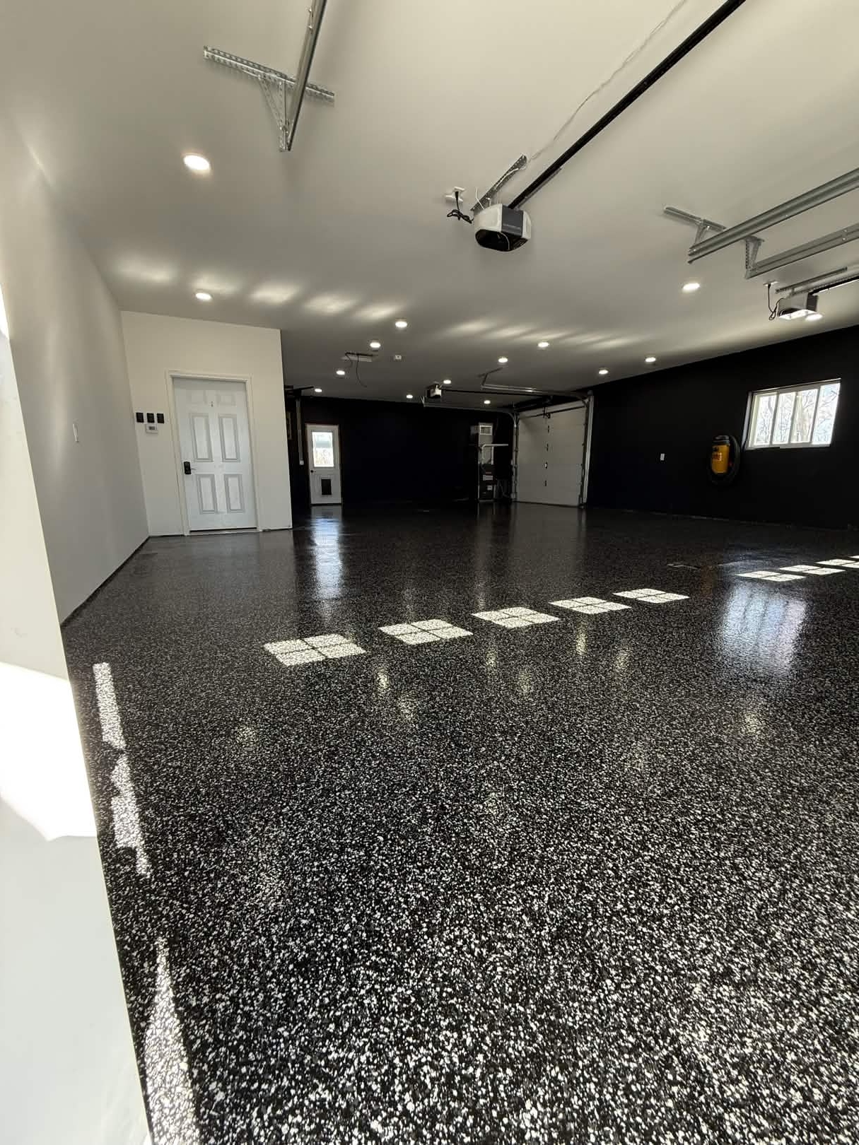 Dark garage β epoxy finished, wide angle