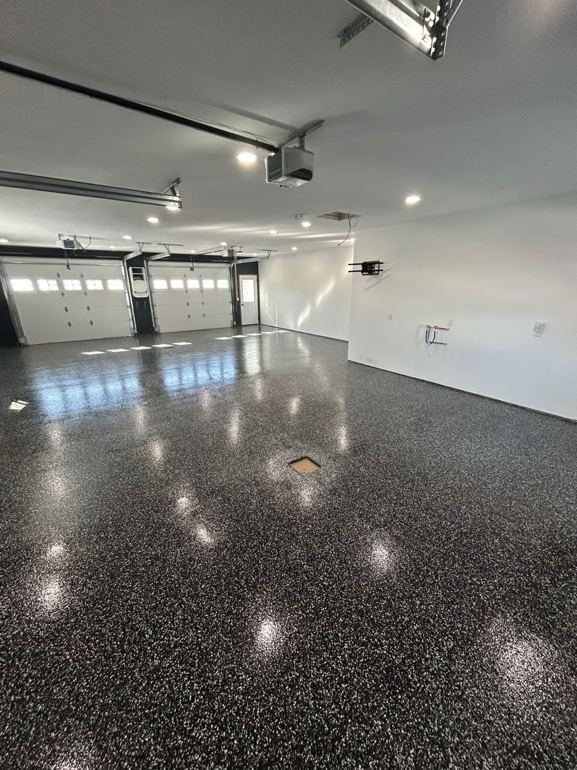 Dark garage β epoxy finished, triple bay